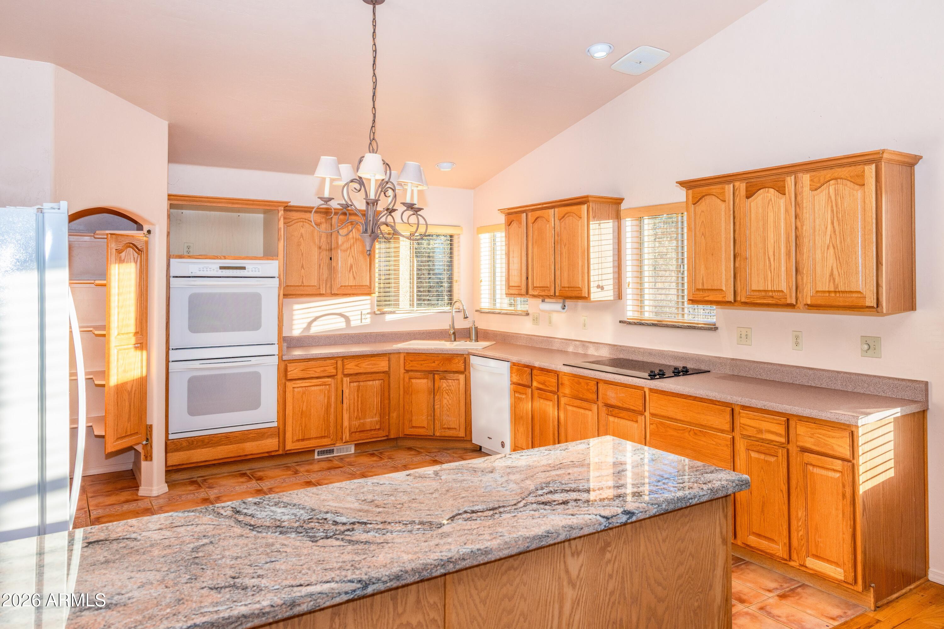 14350 East Meadow Ranch Place Dewey, AZ 86327 - Photo 17 of 54 a kitchen with a sink stove and refrigerator