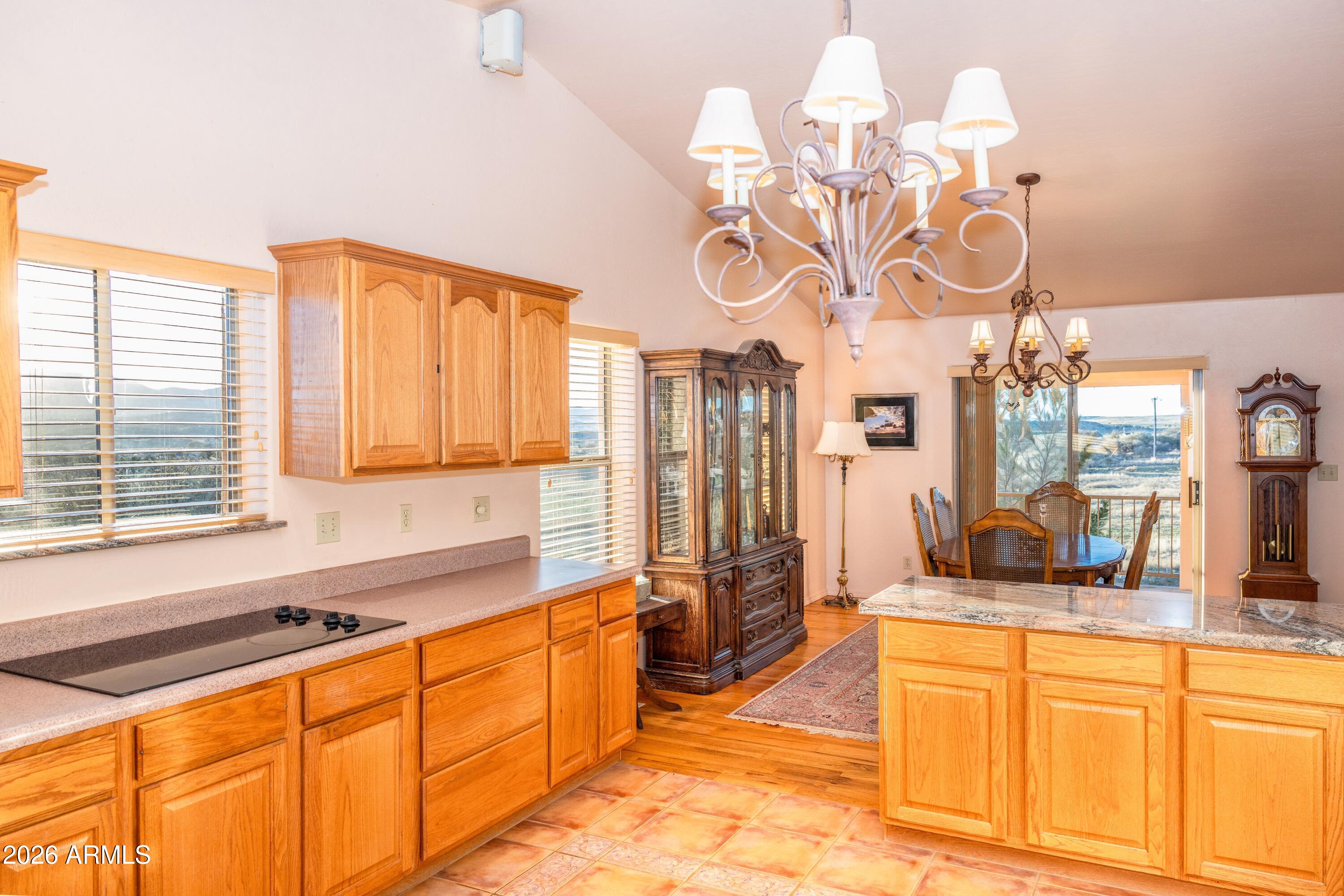 14350 East Meadow Ranch Place Dewey, AZ 86327 - Photo 18 of 54 a large kitchen with a large window cabinets and stainless steel appliances