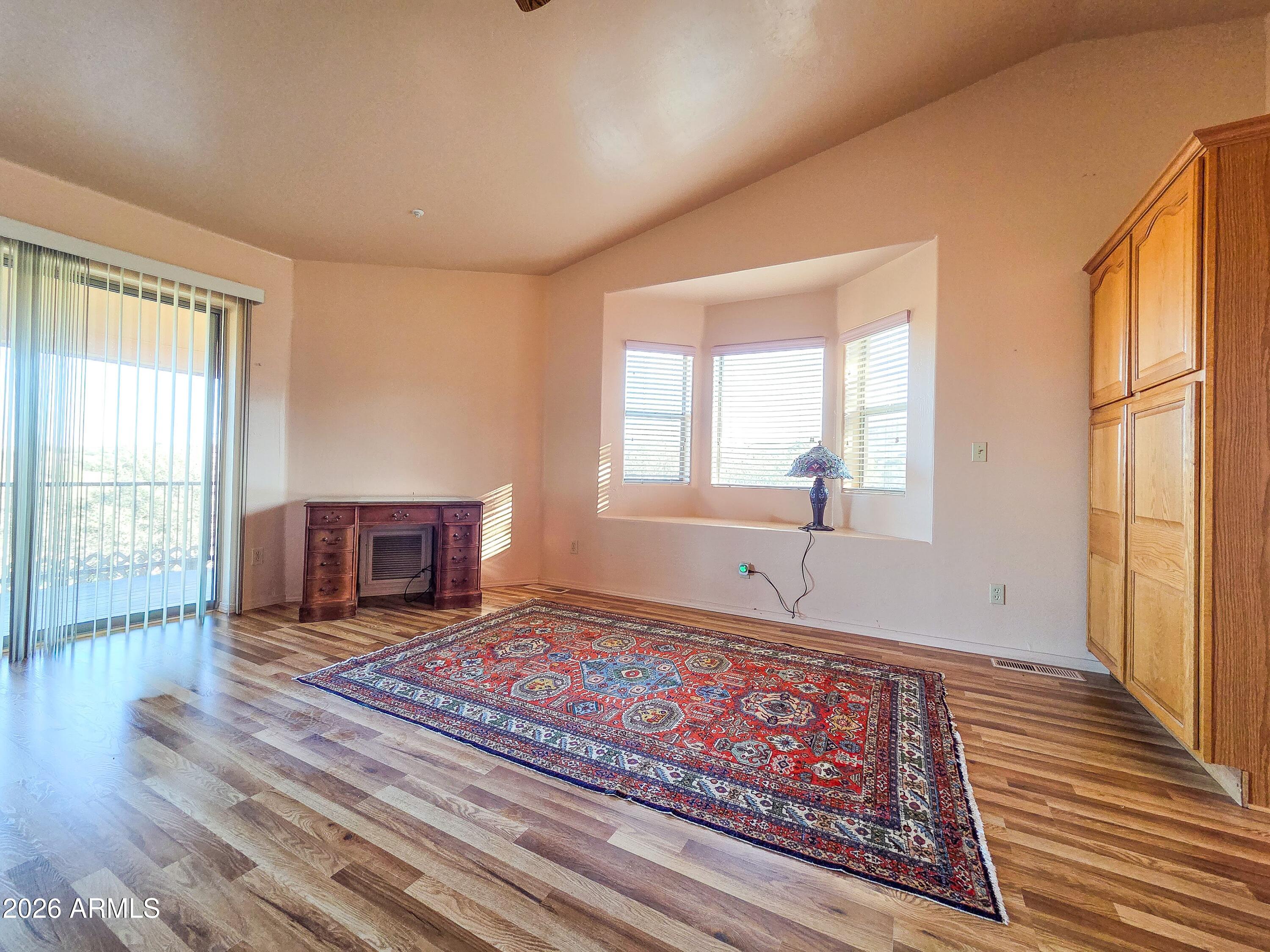14350 East Meadow Ranch Place Dewey, AZ 86327 - Photo 20 of 54 a living room with furniture a rug and a window