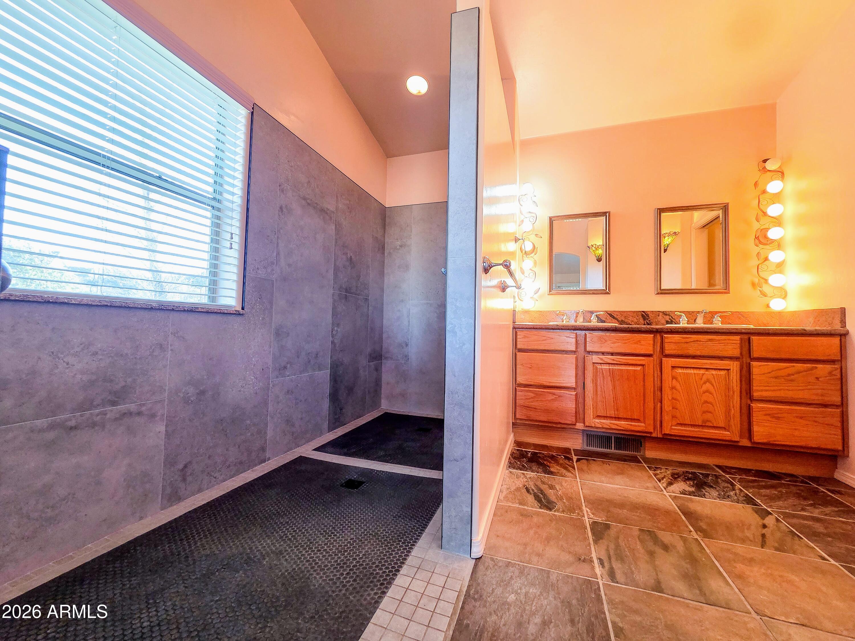 14350 East Meadow Ranch Place Dewey, AZ 86327 - Photo 21 of 54 a bathroom with a sink and a mirror