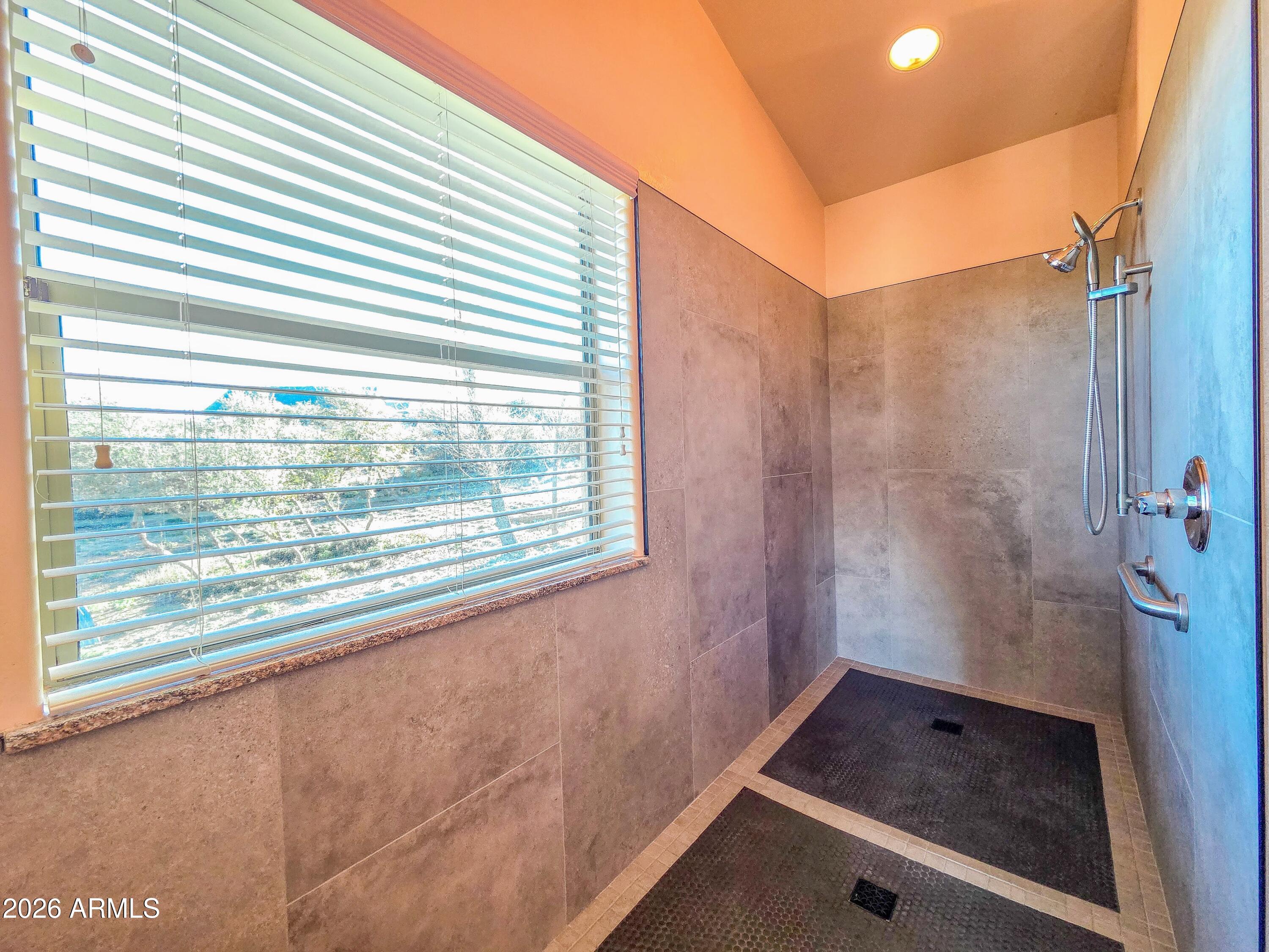 14350 East Meadow Ranch Place Dewey, AZ 86327 - Photo 22 of 54 a bathroom with a tub and shower