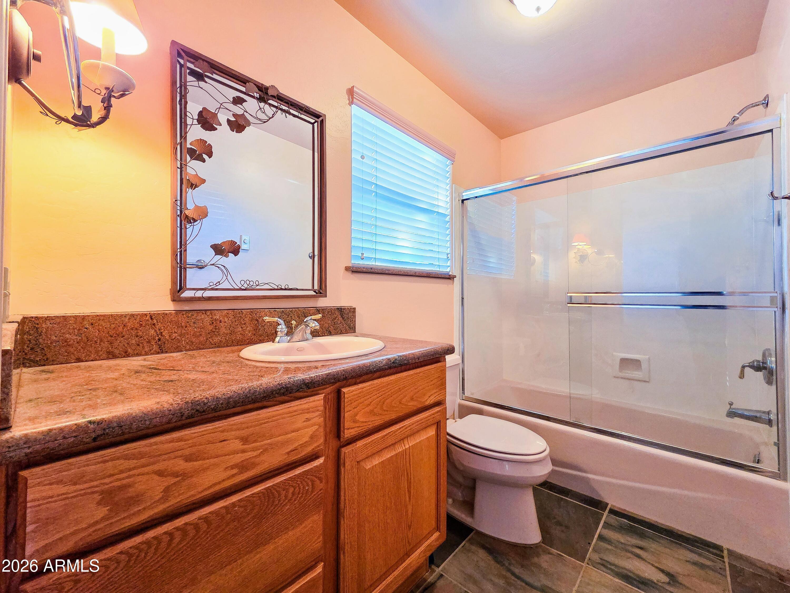 14350 East Meadow Ranch Place Dewey, AZ 86327 - Photo 27 of 54 a bathroom with a sink a toilet and shower