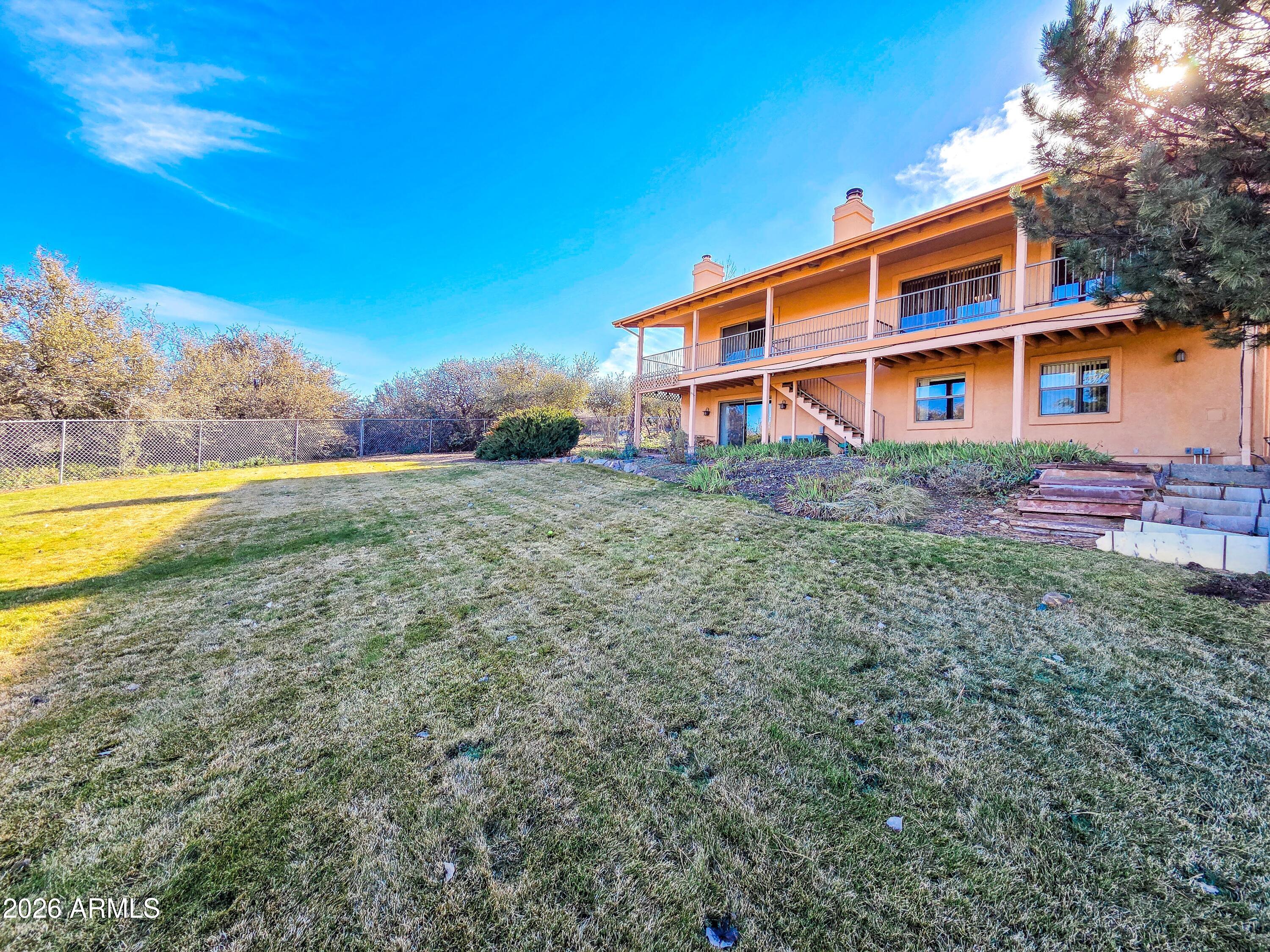14350 East Meadow Ranch Place Dewey, AZ 86327 - Photo 6 of 54 a front view of a house with a yard