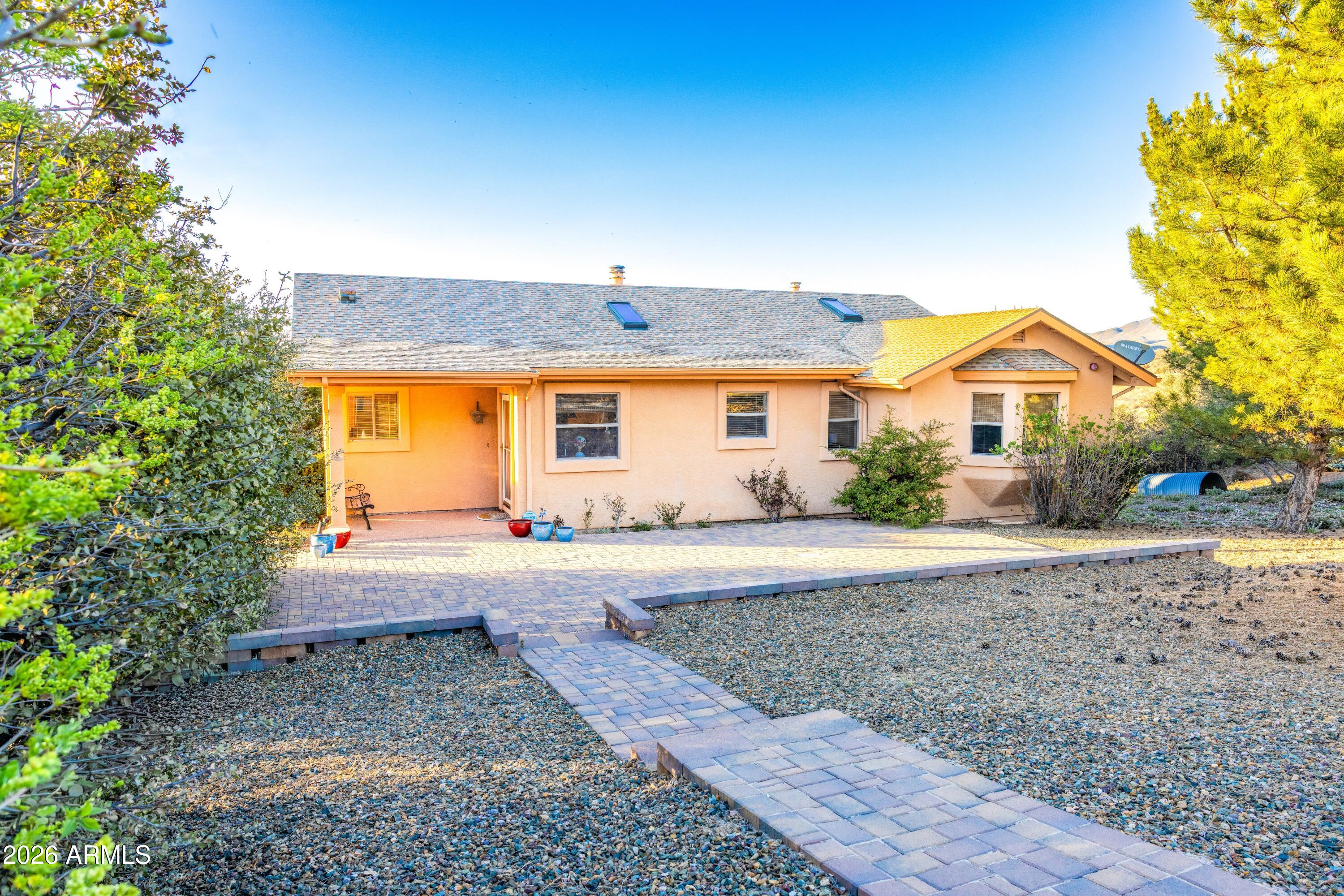 14350 East Meadow Ranch Place Dewey, AZ 86327 - Photo 8 of 54 a view of a house with a yard and large tree