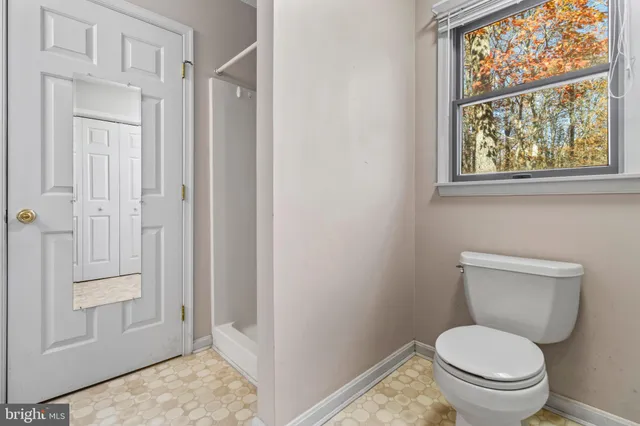 a bathroom with a tub and a shower