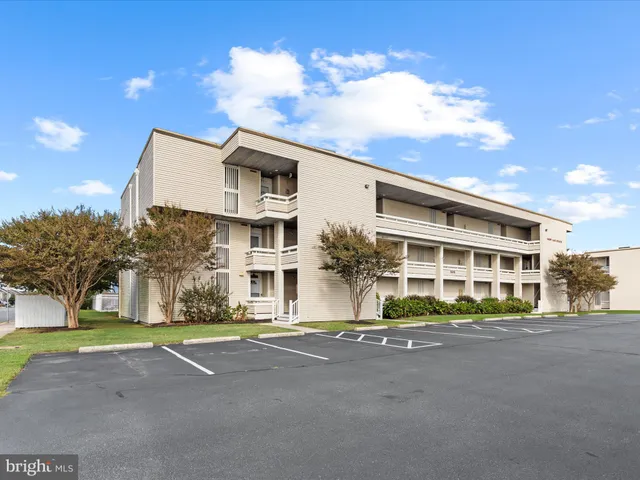a front view of building with yard