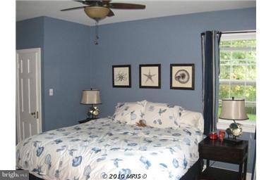 1010 Ashton Road Ashton, MD 20861 - Photo 3 of 12 a bedroom with a bed and a window