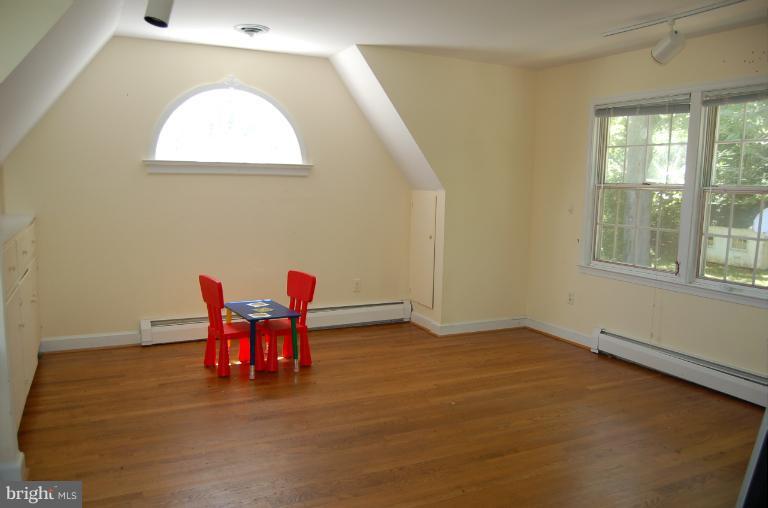 1010 Ashton Road Ashton, MD 20861 - Photo 6 of 12 a view of a room with furniture and a window