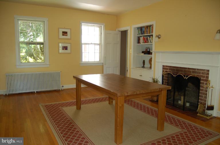 1010 Ashton Road Ashton, MD 20861 - Photo 7 of 12 a view of a livingroom with furniture and a fireplace