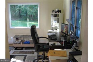 1010 Ashton Road Ashton, MD 20861 - Photo 8 of 12 a view of a workspace with furniture and a window