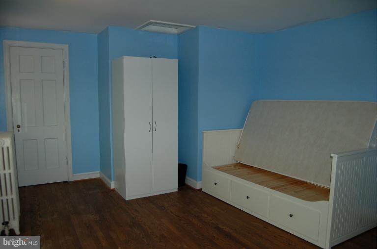 1010 Ashton Road Ashton, MD 20861 - Photo 10 of 12 an empty room with wooden floor