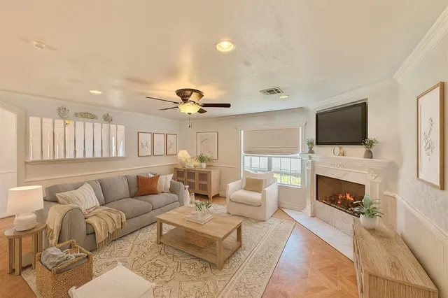 a living room with furniture fireplace and a flat screen tv