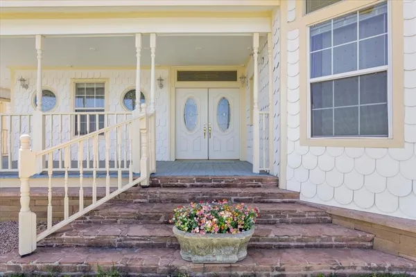 a view of entryway with wooden floor