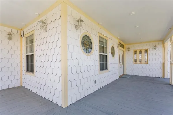 a view of an entryway with wooden floor