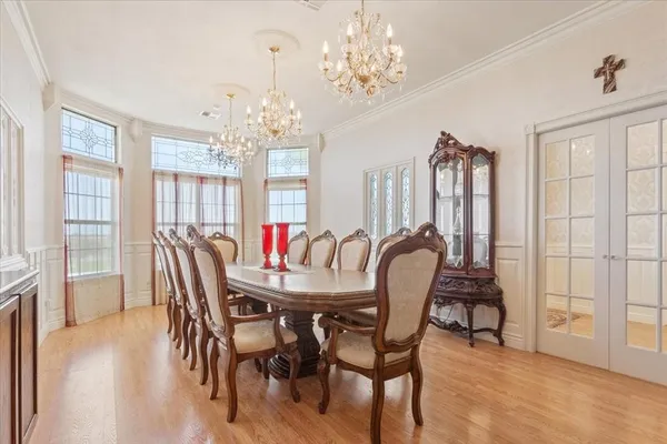 a living room with furniture a piano and a window