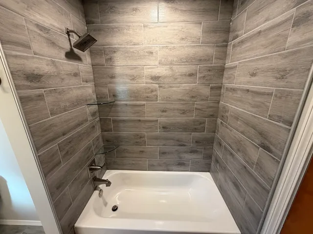 a bathroom with a white bath tub