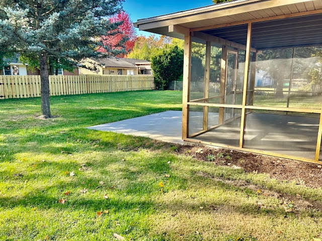 1011 Monroe Drive Bloomington, IL 61701 - Photo 23 of 25 a backyard of a house with table and chairs