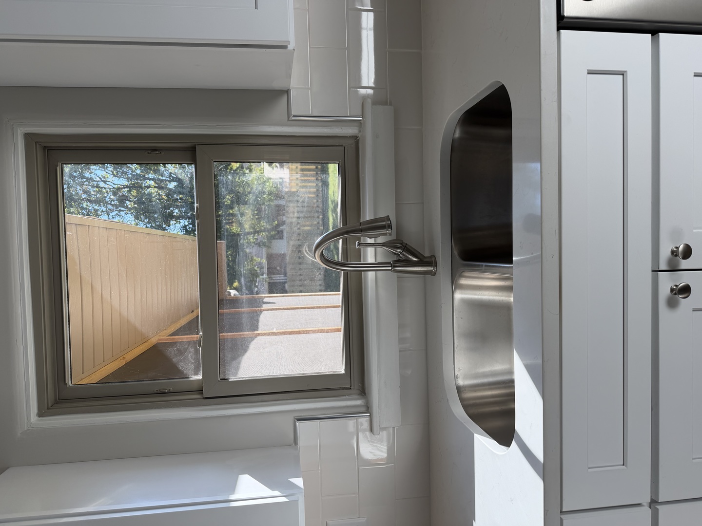 1011 Monroe Drive Bloomington, IL 61701 - Photo 9 of 25 a kitchen with a refrigerator and a window