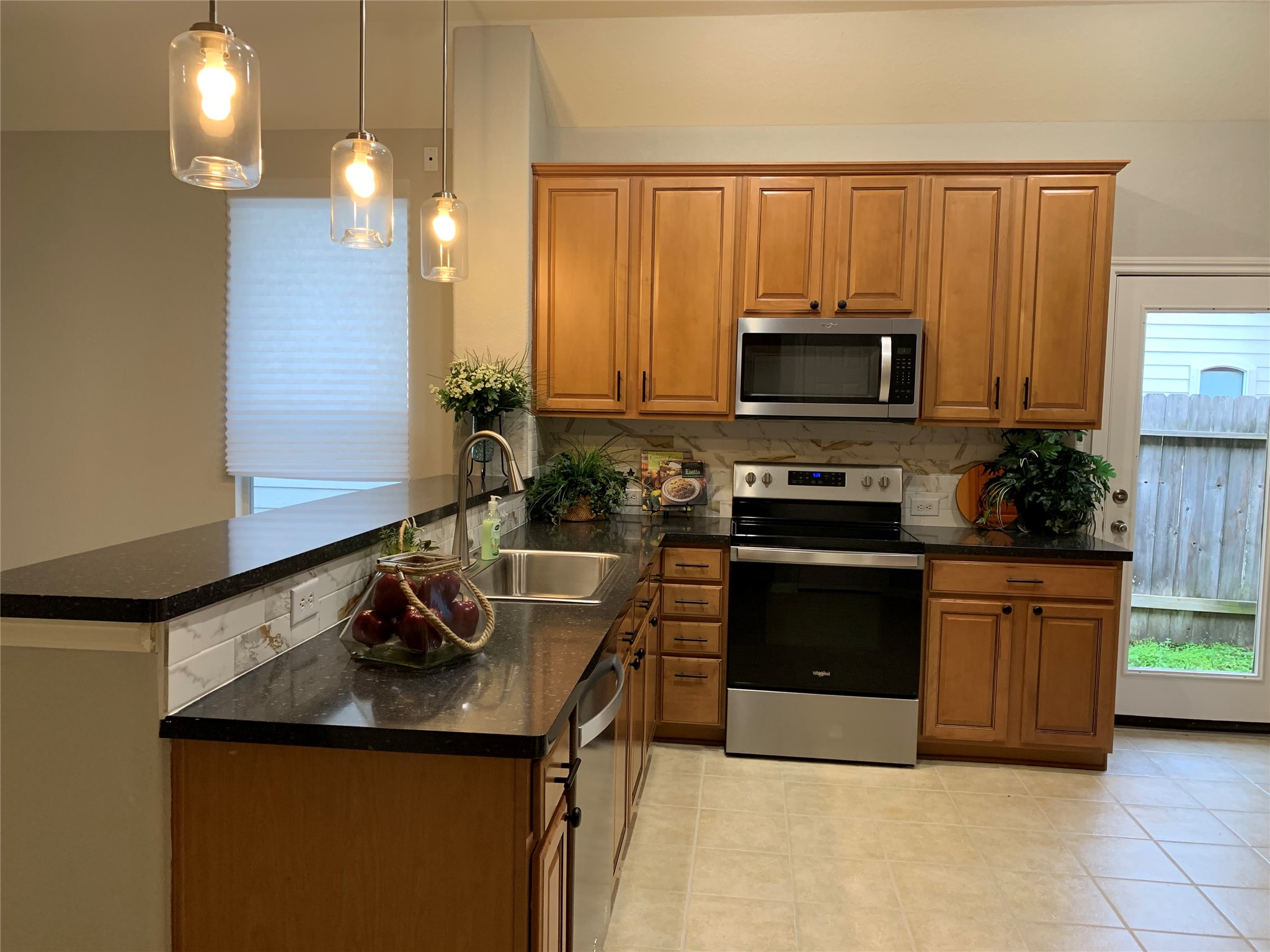 46 Patina Pines Court Spring, TX 77381 - Photo 10 of 30 Spacious kitchen & breakfast area with a high bar to hang out.