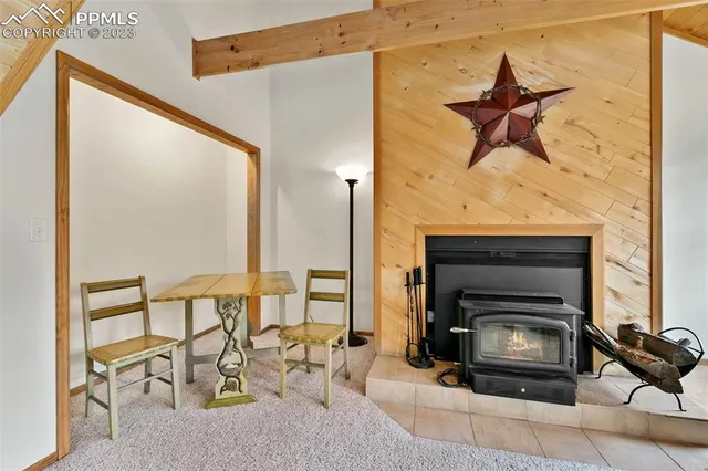 a kitchen with a sink cabinets stainless steel appliances and a window