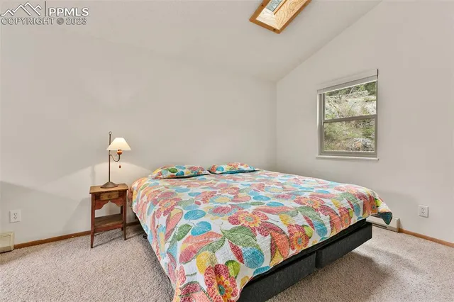 a bedroom with a bed and a table