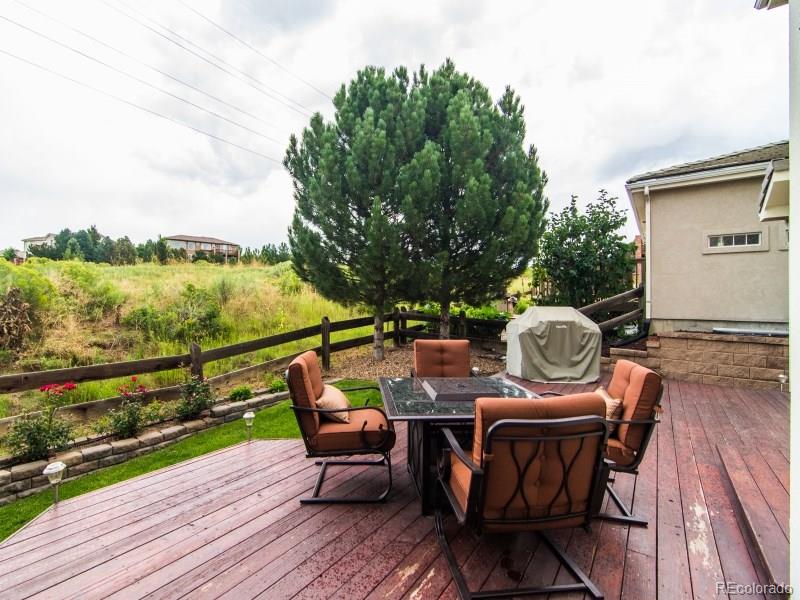 2373 West Bitterroot Place Highlands Ranch, CO 80129 - Photo 29 of 34 a view of deck with furniture and stove