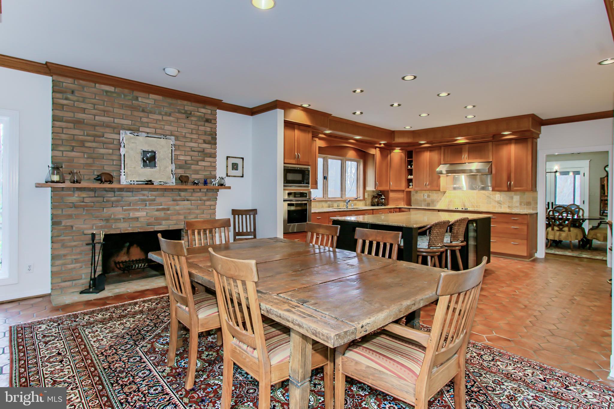 7600 Potomac Fall Road McLean, VA 22102 - Photo 8 of 29 Informal Dining Area with Wood-Burning Fireplace