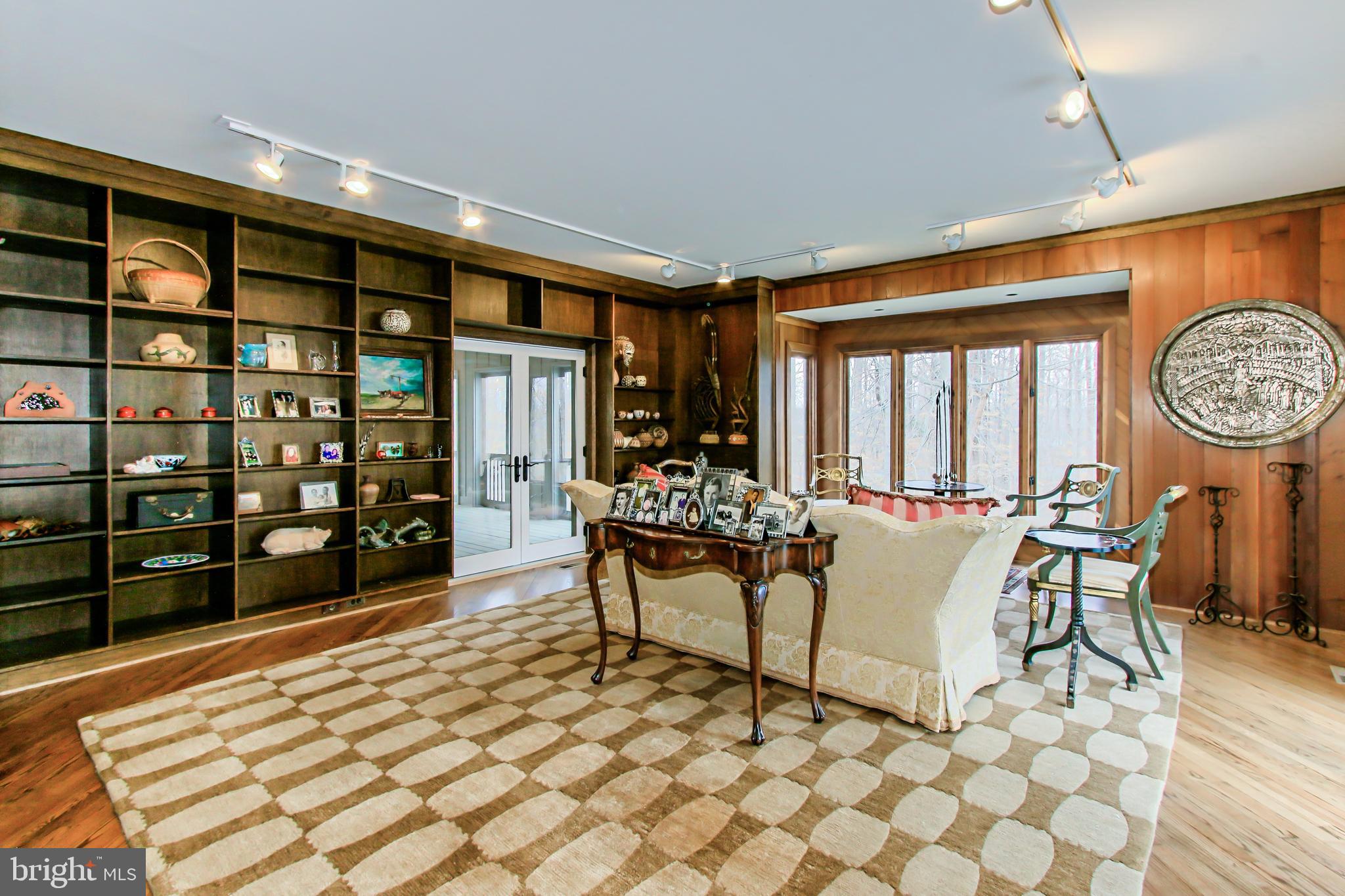 7600 Potomac Fall Road McLean, VA 22102 - Photo 10 of 29 Library with Built-ins and Access to Two Terraces
