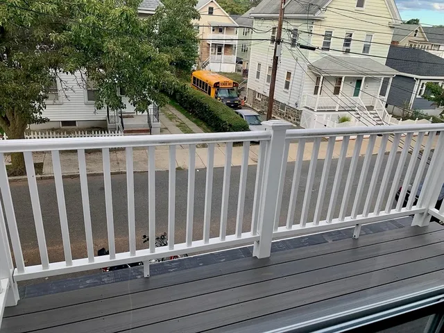 a view of a brick house with a large window