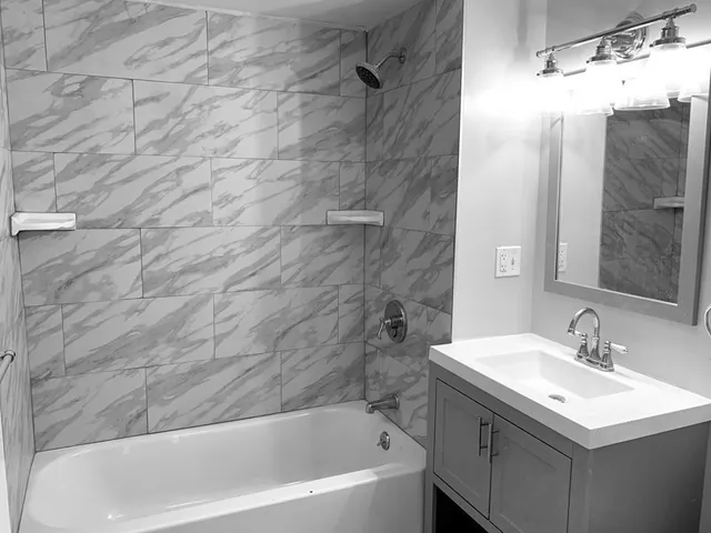 a bathroom with a sink and a bathtub