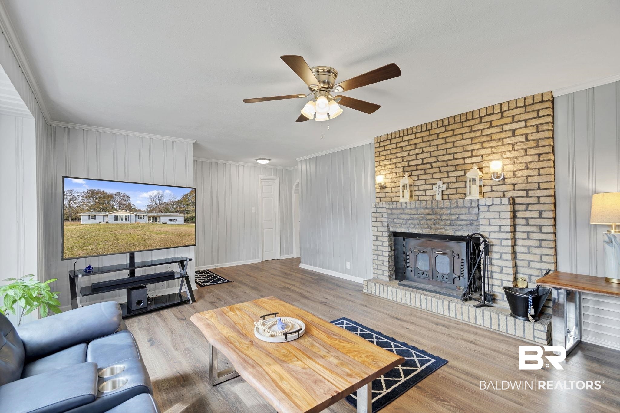 4690 Lott Road Eight Mile, AL 36613 - Photo 15 of 45 Living room featuring ceiling fan, a fireplace, and light wood-type flooring