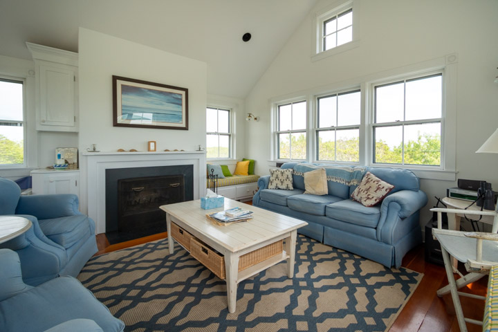 94-21 Tuckernuck Nantucket, MA 02554 - Photo 7 of 20 a living room with furniture a rug and a fireplace
