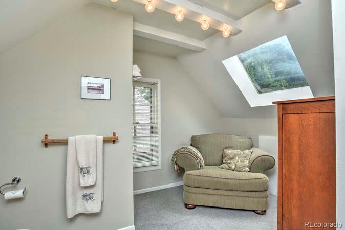 2536 Glencoe Street Denver, CO 80207 - Photo 11 of 26 a living room with furniture and a window