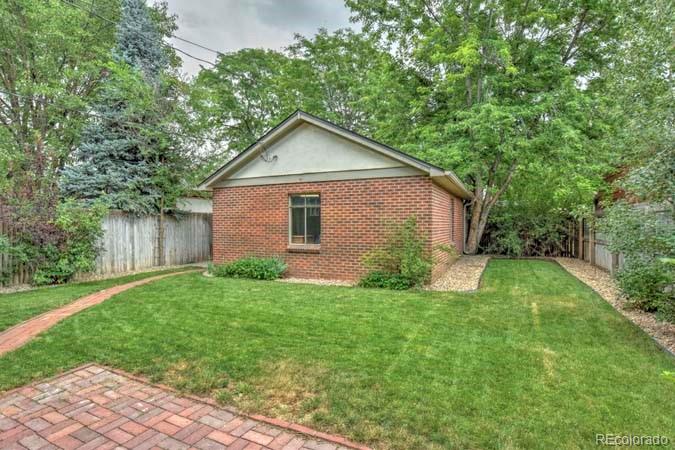 2536 Glencoe Street Denver, CO 80207 - Photo 17 of 26 a view of backyard of house with green space