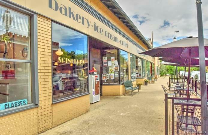 2536 Glencoe Street Denver, CO 80207 - Photo 19 of 26 a view of a building with a porch