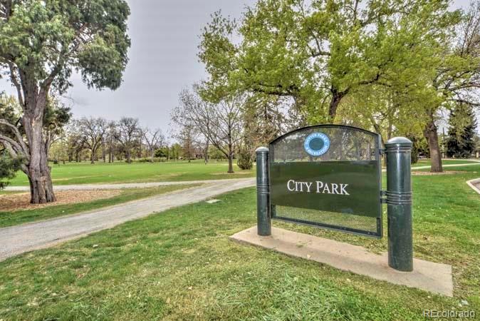 2536 Glencoe Street Denver, CO 80207 - Photo 21 of 26 a view of a park with trees and sign