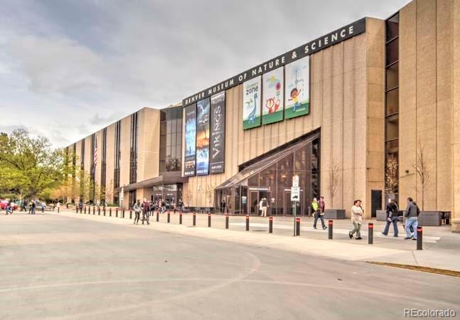 2536 Glencoe Street Denver, CO 80207 - Photo 25 of 26 a city street with a building and a street view