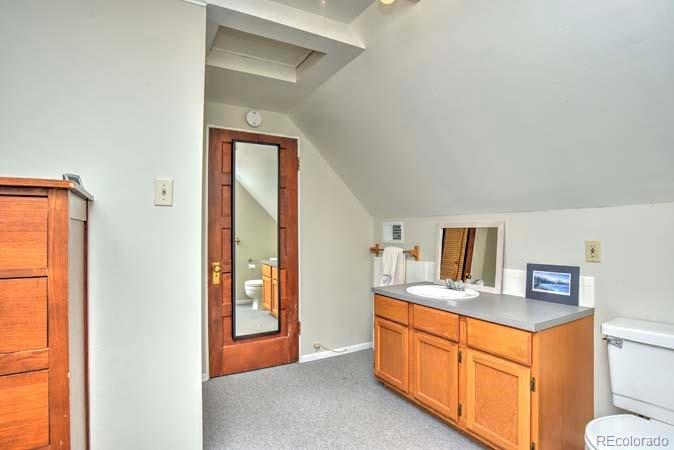2536 Glencoe Street Denver, CO 80207 - Photo 10 of 26 a view of a bathroom from the hallway