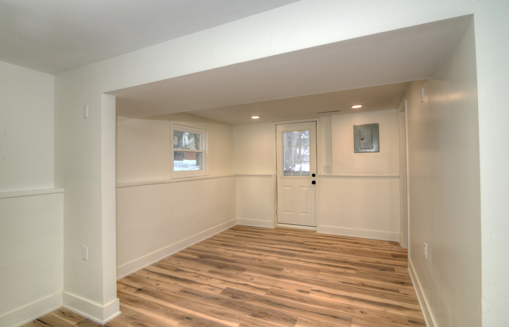 4818 Strong Road Crystal Lake, IL 60014 - Photo 17 of 31 a view of a big room with wooden floor and windows