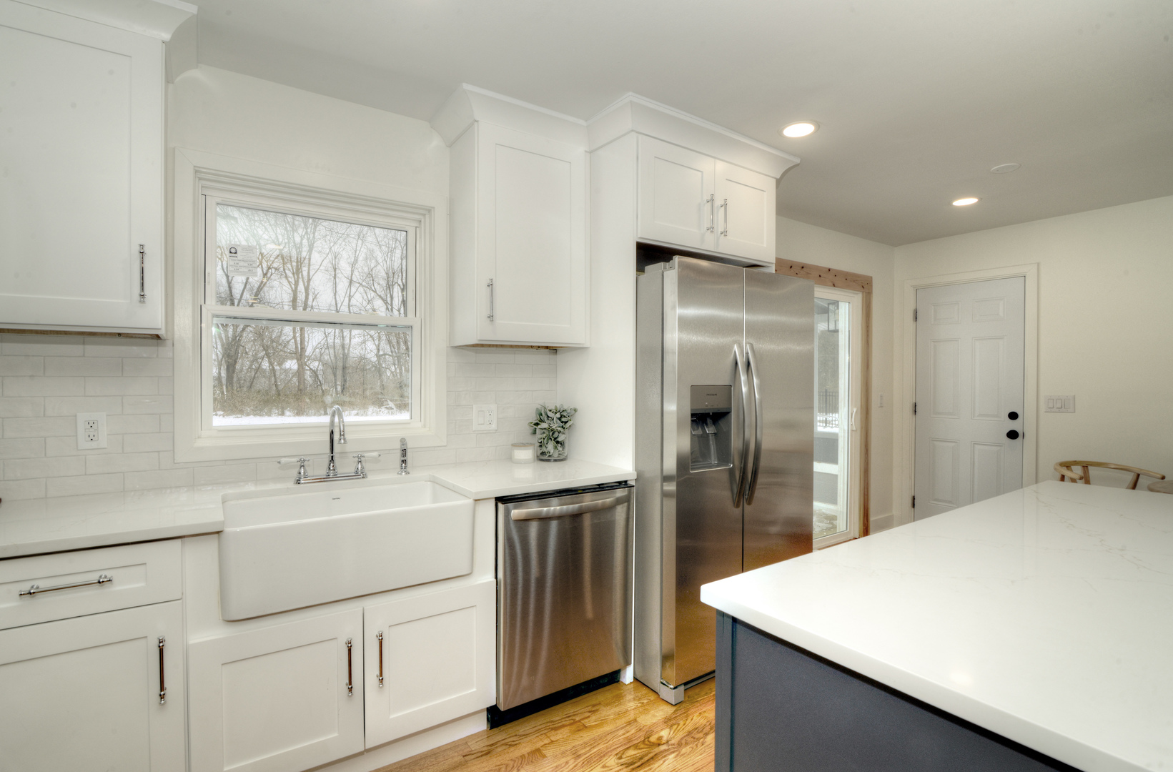 4818 Strong Road Crystal Lake, IL 60014 - Photo 8 of 31 a kitchen with kitchen island a sink appliances and cabinets