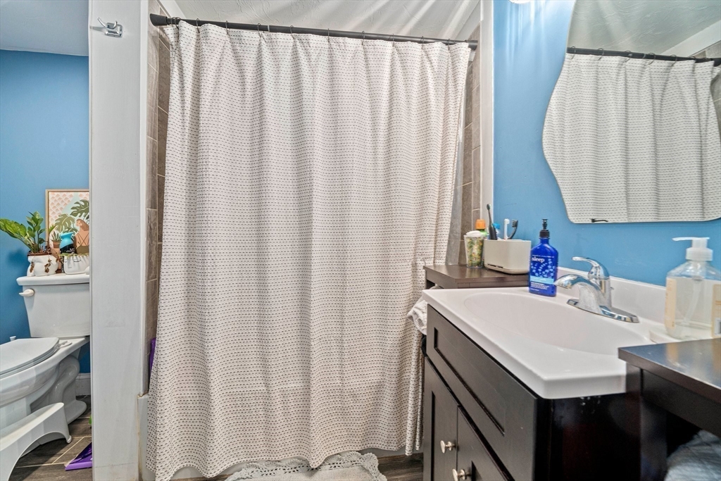 100 Indian Trail Pembroke, MA 02359 - Photo 15 of 29 a bathroom with a sink a vanity and a curtain
