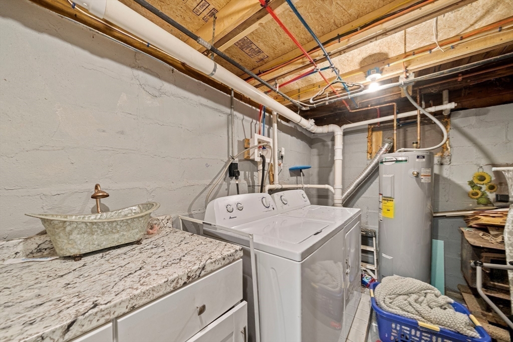 100 Indian Trail Pembroke, MA 02359 - Photo 16 of 29 a utility room with dryer and washer