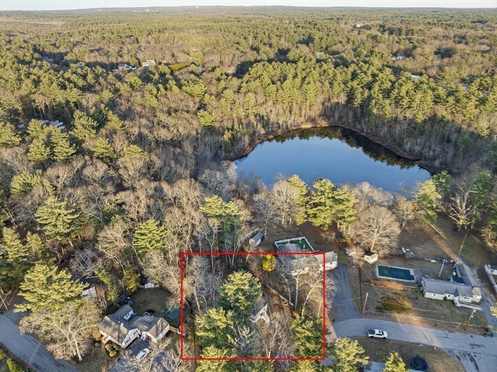 100 Indian Trail Pembroke, MA 02359 - Photo 18 of 29 an aerial view of residential house and lake with trees all around
