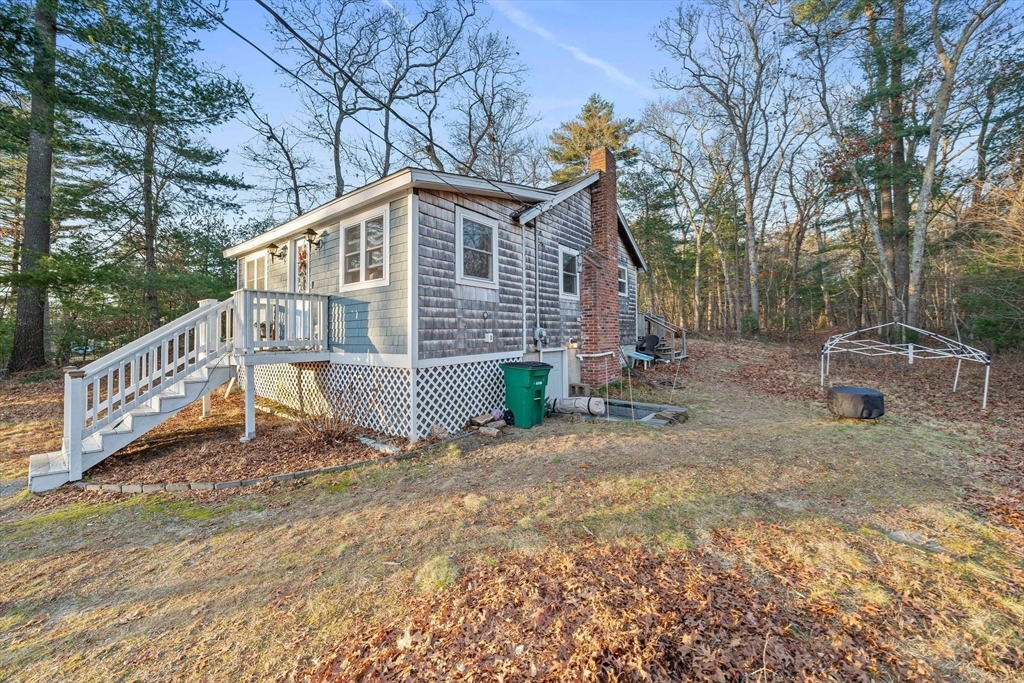 100 Indian Trail Pembroke, MA 02359 - Photo 23 of 29 a view of a house with backyard and wooden fence