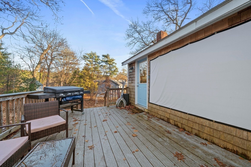 100 Indian Trail Pembroke, MA 02359 - Photo 24 of 29 a patio with wooden floor and outdoor seating