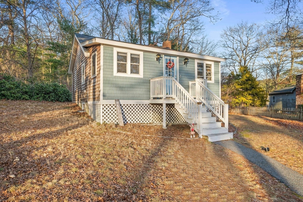 100 Indian Trail Pembroke, MA 02359 - Photo 5 of 29 a front view of a house with a yard