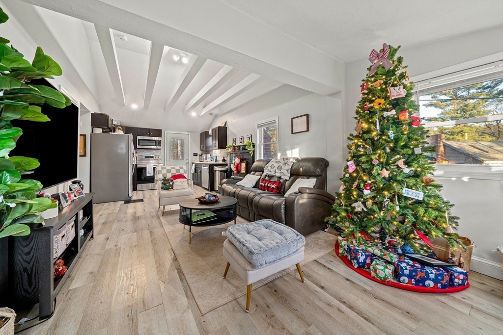 100 Indian Trail Pembroke, MA 02359 - Photo 7 of 29 a living room with furniture and a potted plant