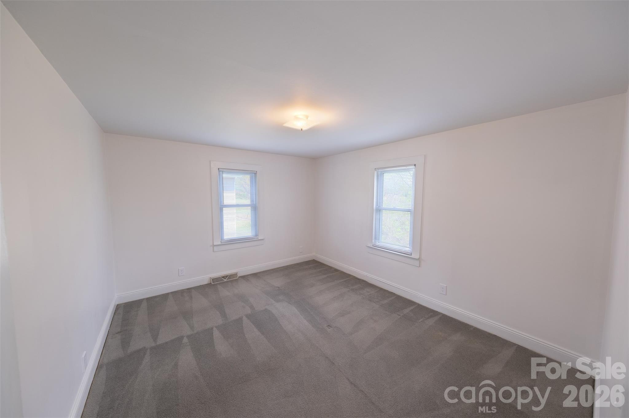 166 Spruce Street Canton, NC 28716 - Photo 11 of 23 an empty room with windows