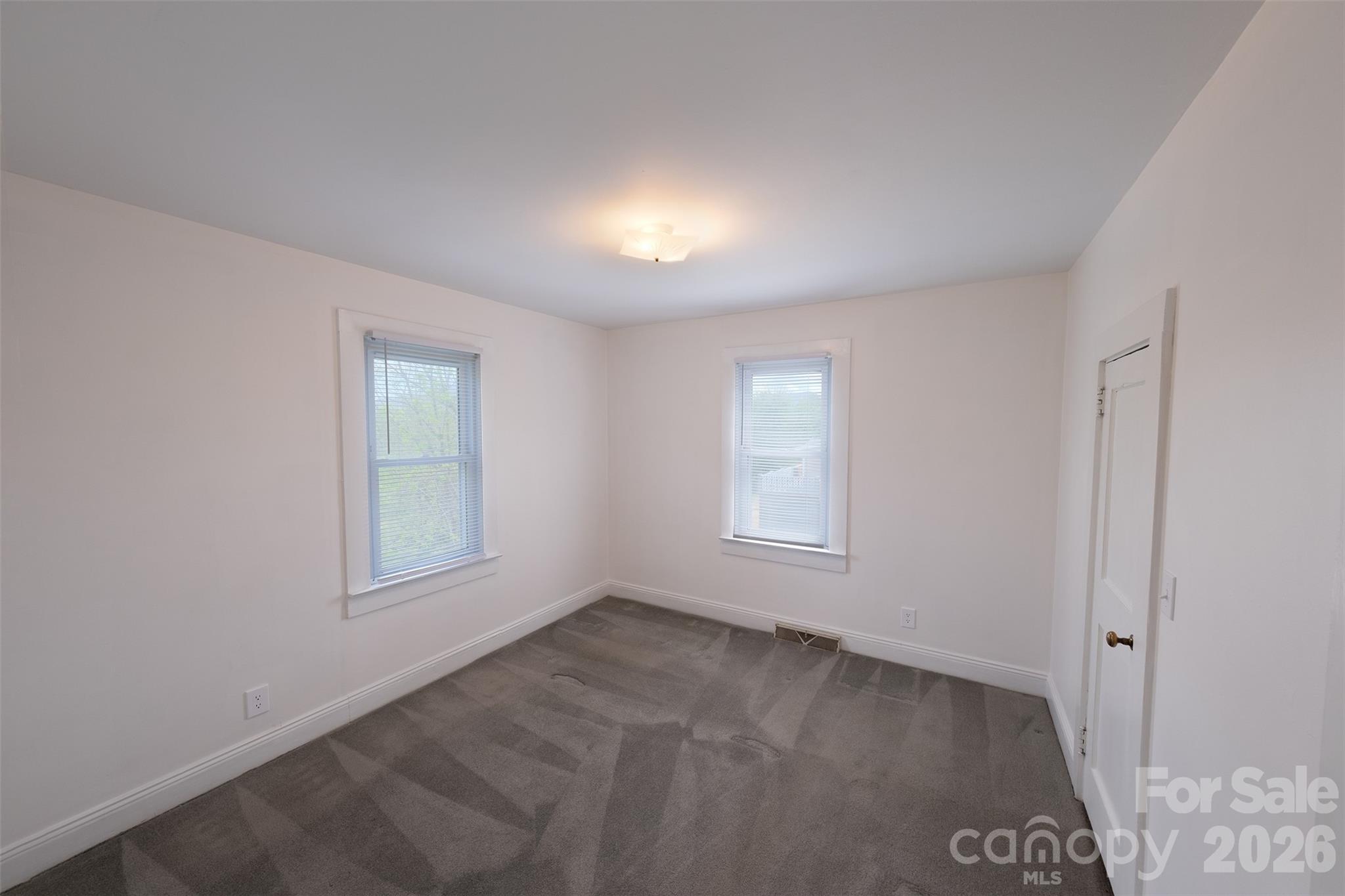 166 Spruce Street Canton, NC 28716 - Photo 13 of 23 an empty room with windows