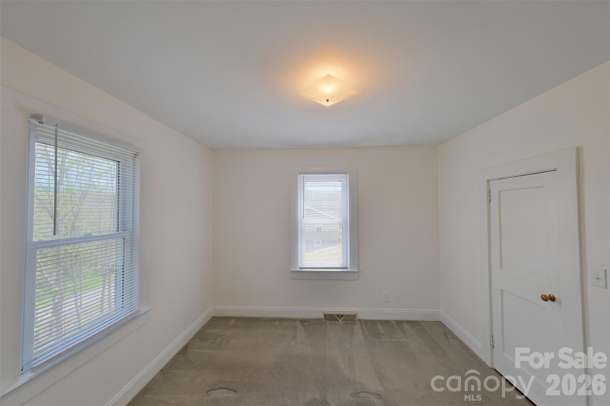 166 Spruce Street Canton, NC 28716 - Photo 14 of 23 an empty room with windows